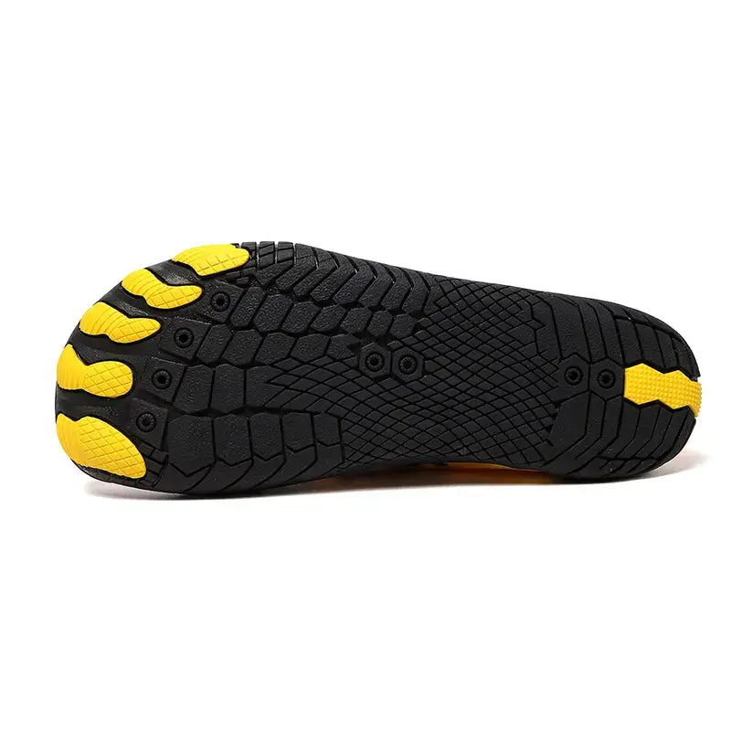 Person wearing yellow Hazers barefoot sneakers